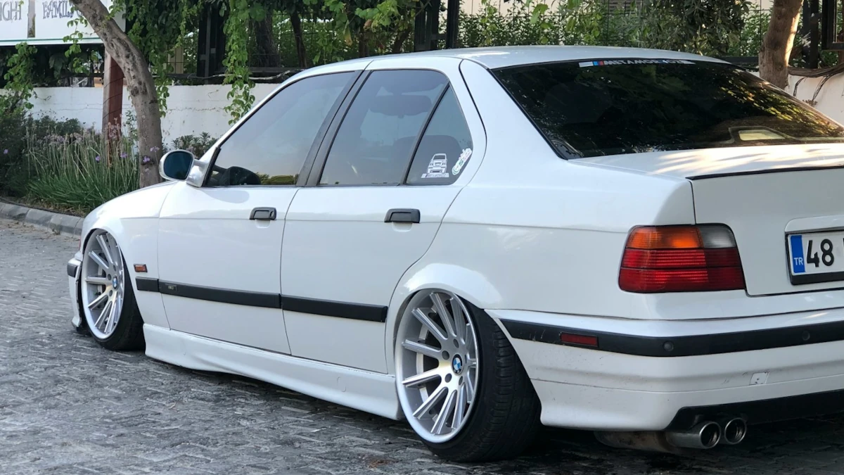 Demo36 Parked White Bmw Sedan Beside White Wall