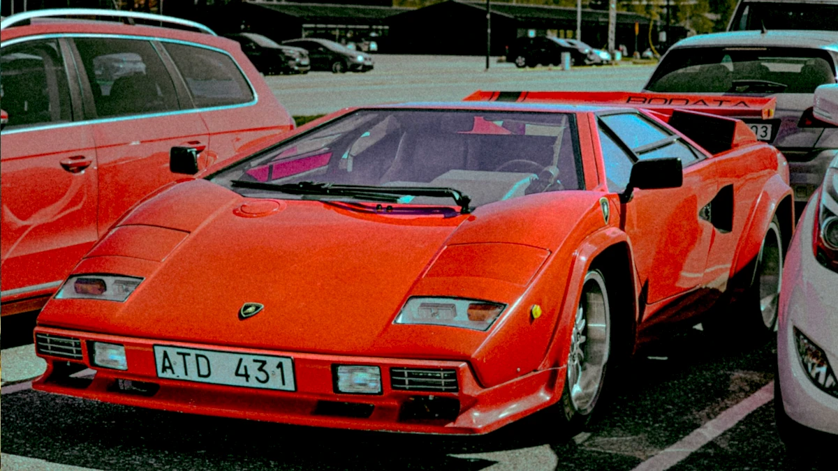 Demo37 A Group Of Cars Parked Next To Each Other In A Parking Lot